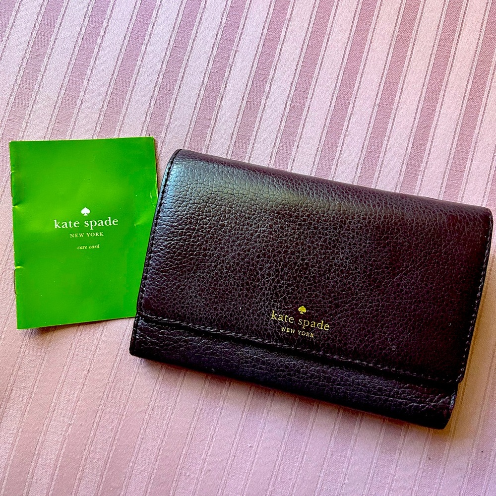 Dark purple Kate Spade wallet. Used. Purchased at Nordstrom.